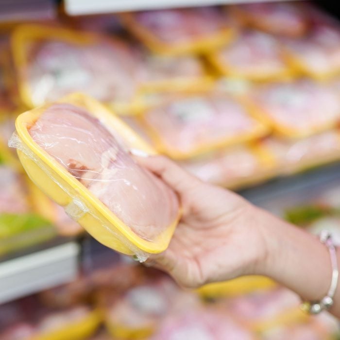 Meat In Food Store . Woman Choosing Packed Raw Chicken Meat In Supermarket