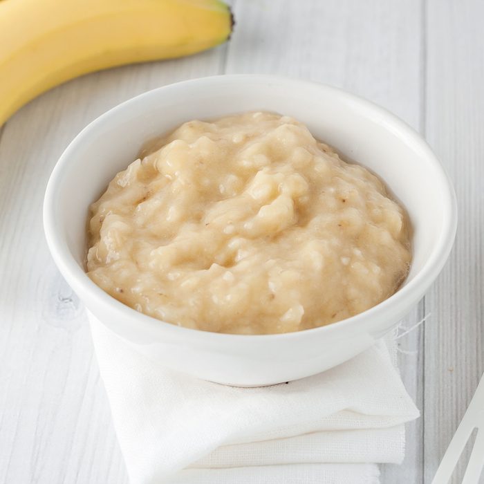 mashed banana in white bowl