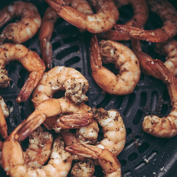 Roasted shrimps with garlic and herbs. Seafood, shelfish.