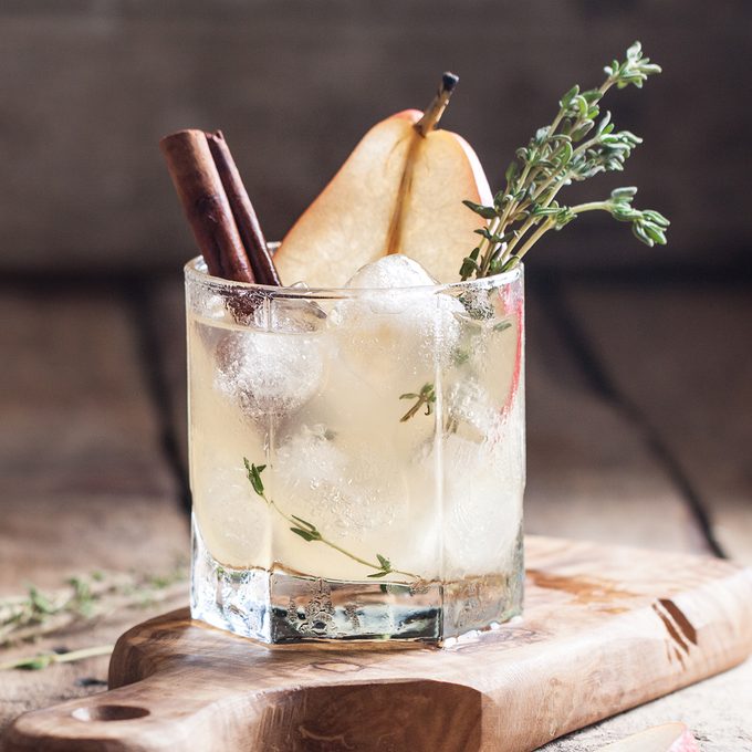 Cold pear white tea with thyme, cinnamon and honey on the olive desk and wooden background; Shutterstock ID 489772735; Job (TFH, TOH, RD, BNB, CWM, CM): Taste of Home