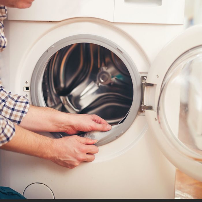 Technician repairing a washing machine; Shutterstock ID 497277193; Job (TFH, TOH, RD, BNB, CWM, CM): Taste of Home