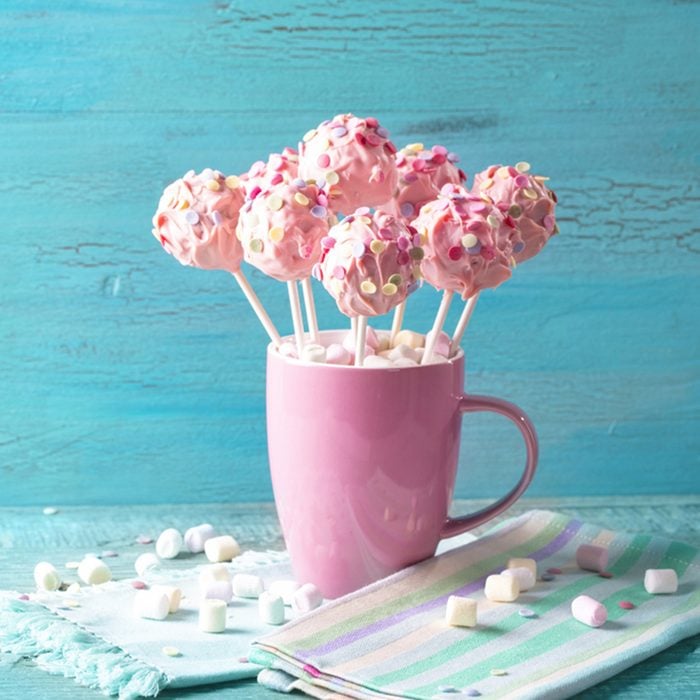 Pink cake pops in a teacup
