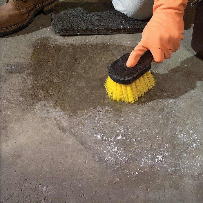 Removing oil with a brush
