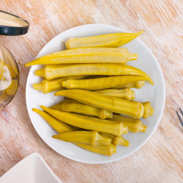 pickled okra on a white plate