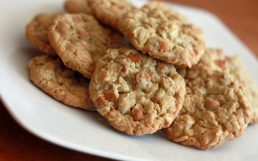 oatmeal butterscotch chip cookie recipe with cookies stacked on a white plate