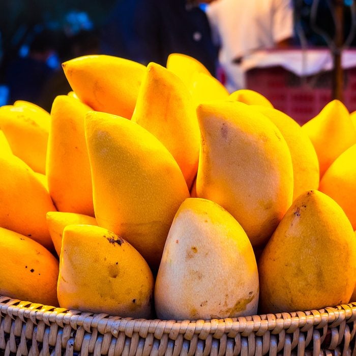 Yellow mango in basket.
