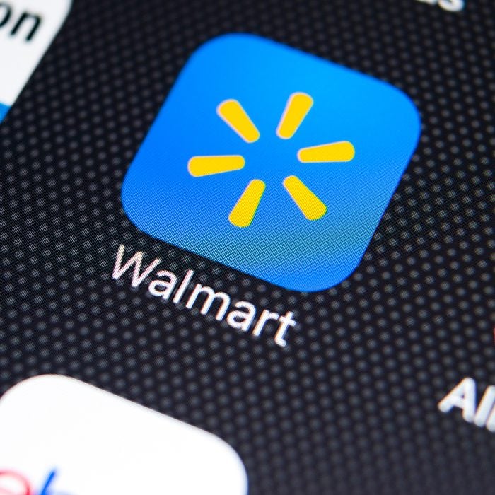 Walmart application icon on Apple iPhone X screen close-up.