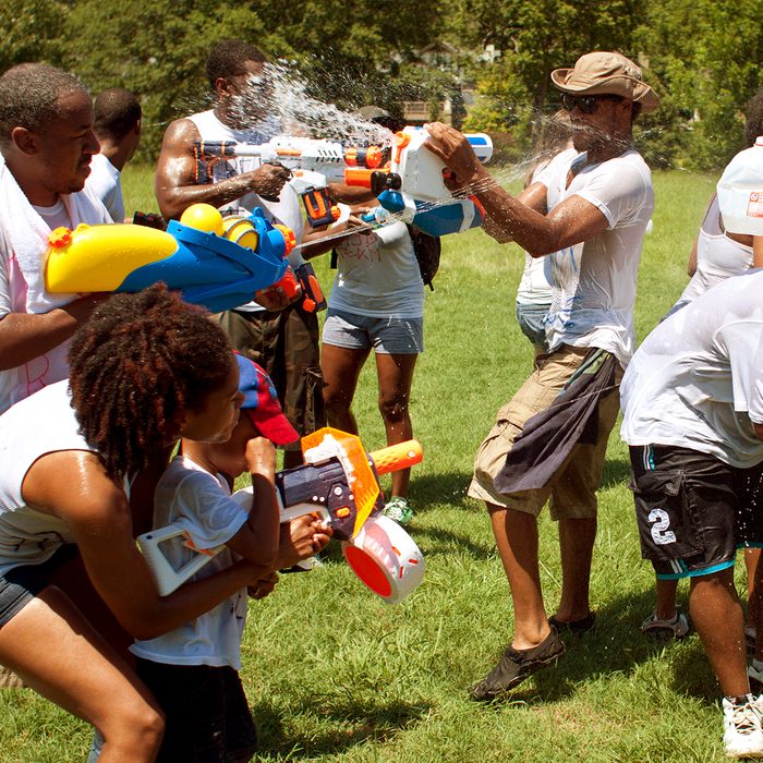 Unidentified people take part in a water gun battle called the Fight4Atlanta, a squirt gun fight between dozens of locals at Freedom Park on July 28, 2012 in Atlanta.