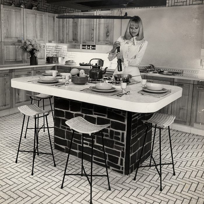 Picture Shows A Woman Cooking In A Kitchen On Show At The Exhibition. 