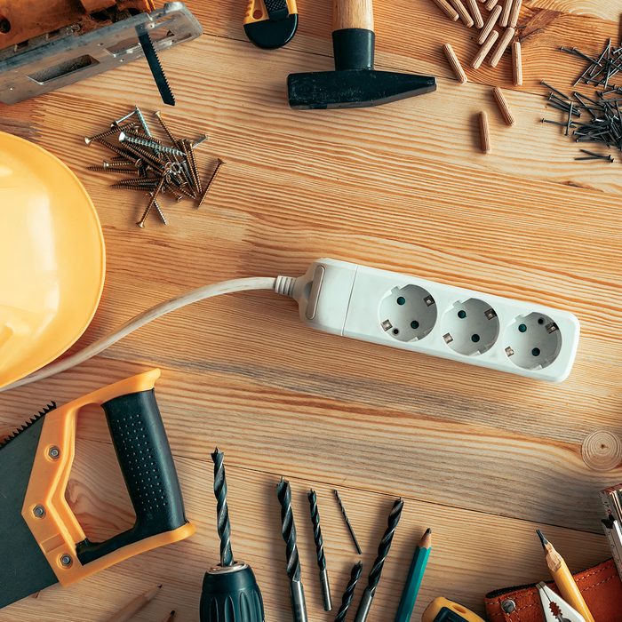 Power strip extension cord on carpentry woodwork woodwork desk