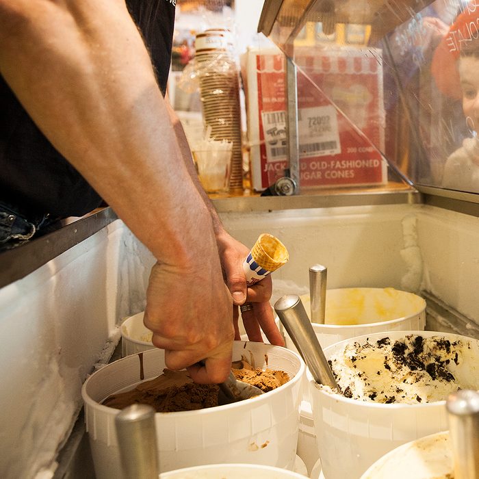 Marc Wheeler, serves up some chocolate ice cream during the fourth annual Free Ice Cream Day on Saturday, April 28, 2018 in Juneau, Alaska.