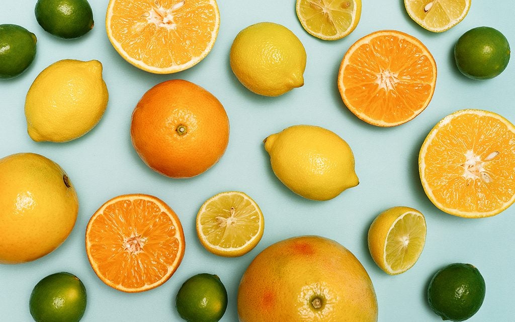 Citrus fruits sliced, lemons, oranges, tangerines and grapefruit.
