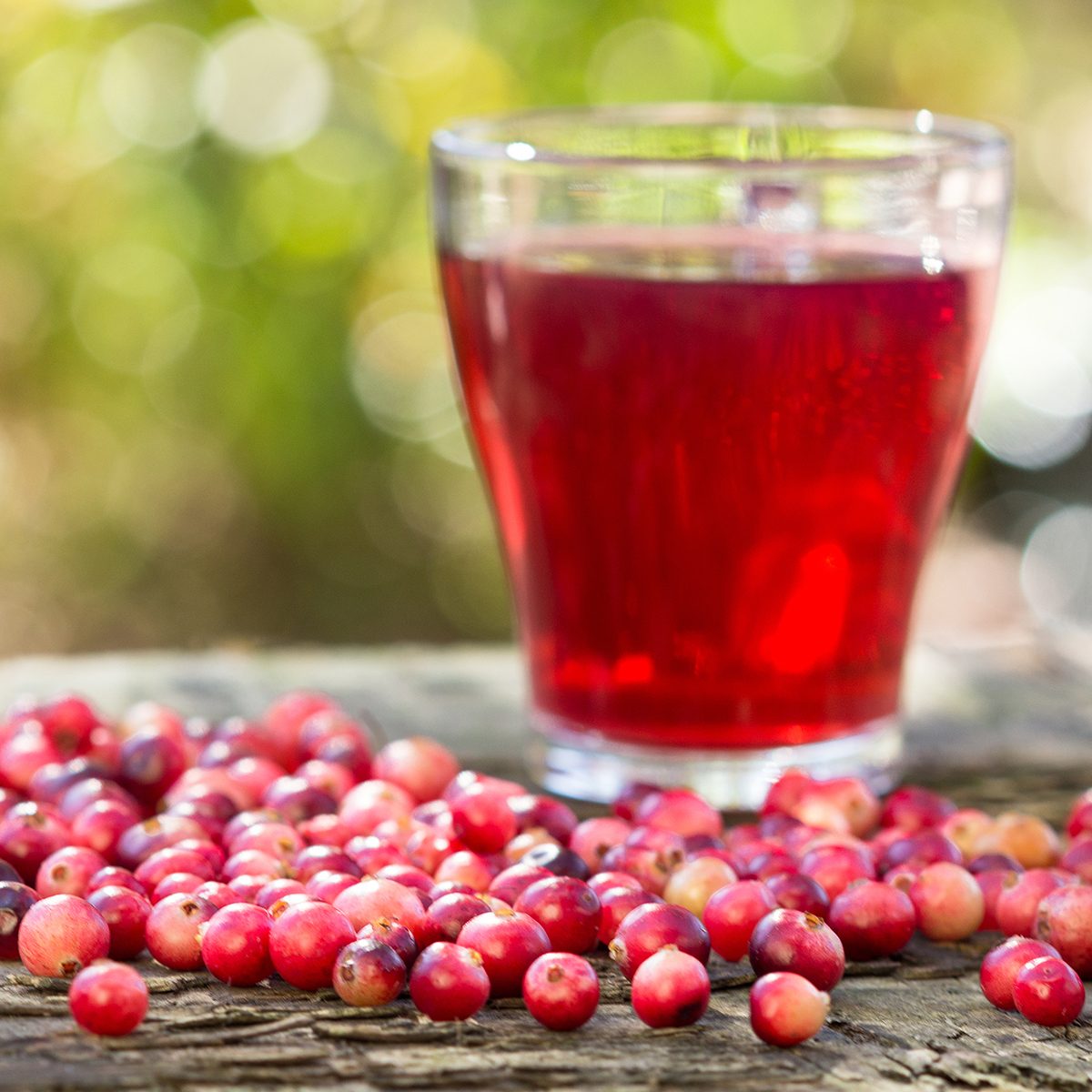 Cranberries and cranberry juice in a glass.