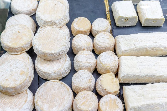 Goat and Sheep Cheese Display at the Farmer's Market; Shutterstock ID 1407689732; Job (TFH, TOH, RD, BNB, CWM, CM): TOH Farmers Market Food Safety