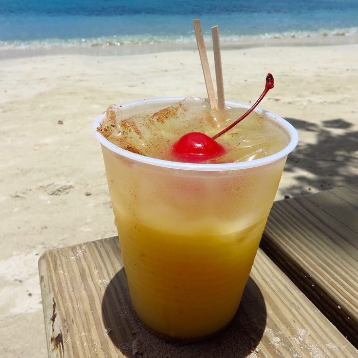 Painkiller fruity tropical rum drink on the beach in St. John, USVI, Virgin Islands, Caribbean