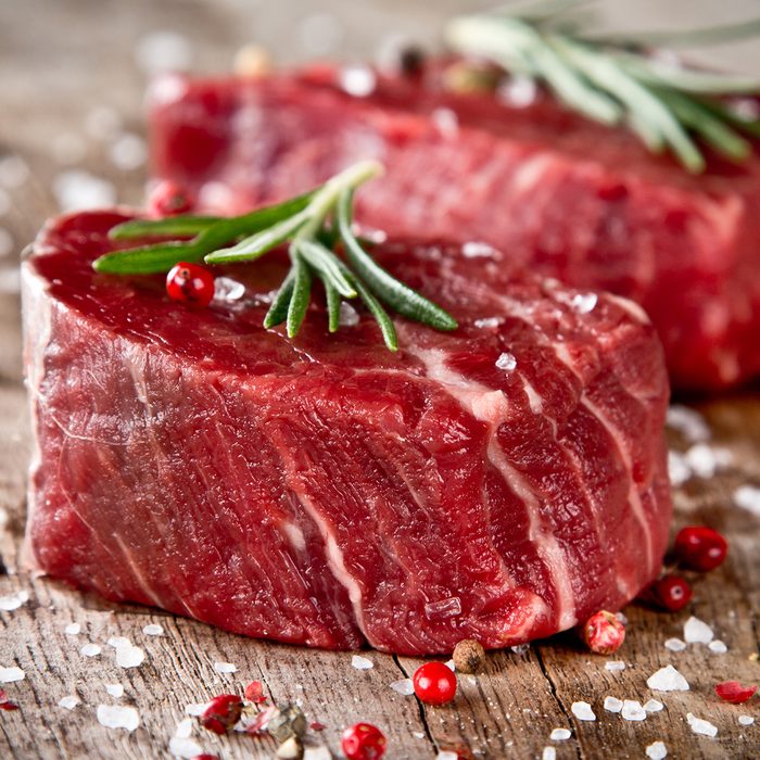 Fresh raw beef steak on wood