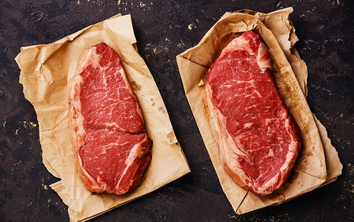 two types of steak on kraft paper