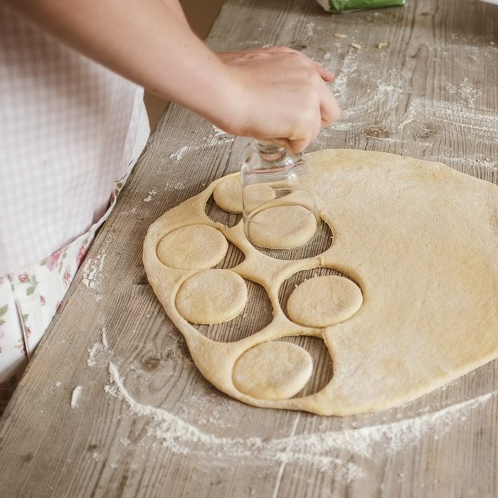 female woman artisan baker at home baking a sweet dough cookies, series from the whole process available ; Shutterstock ID 1073819714; Job (TFH, TOH, RD, BNB, CWM, CM): TOH