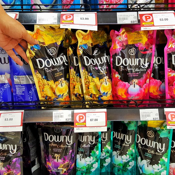 Sriracha, Chonburi THAILAND June 29, 2018: Man's hands are holding a fabric softener brand Downy on the shelves at supermarket.; Shutterstock ID 1126947779