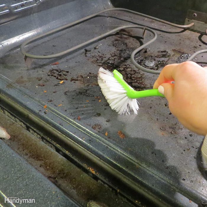 Cleaning oven with brush