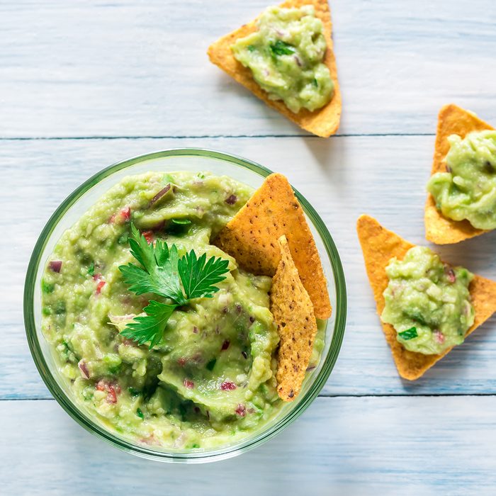 Bowl of guacamole with tortilla chips