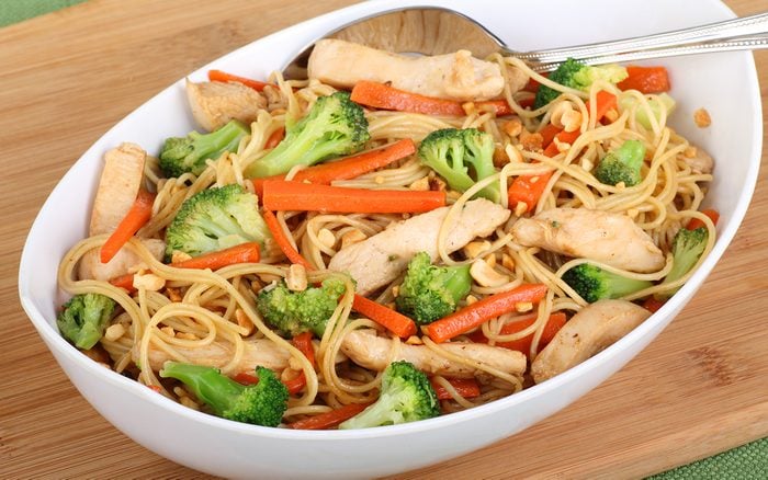 Chicken lo mein with carrots and broccoli in a bowl