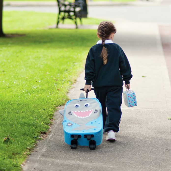 Little girl walking from school