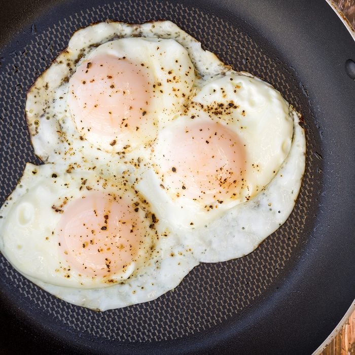 Over-easy eggs with fresh salsa and coffee 