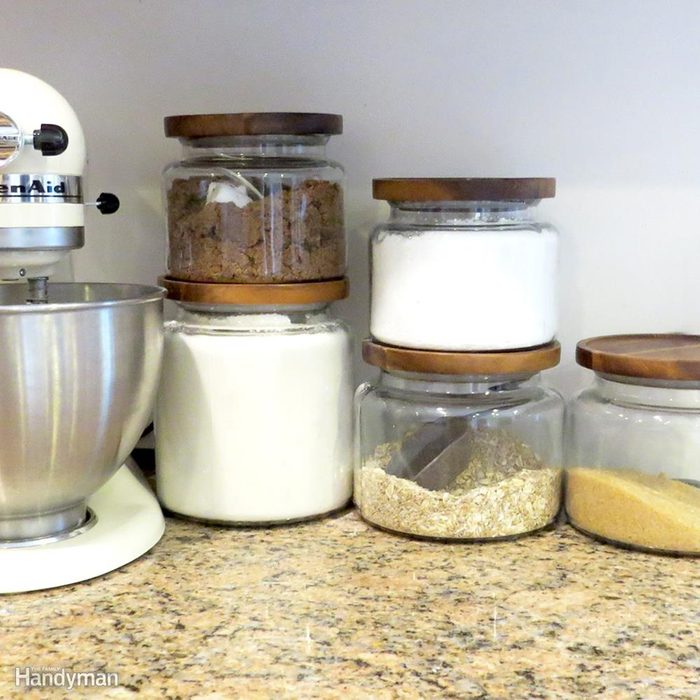 Glass containers filled with pantry staples on the countertops