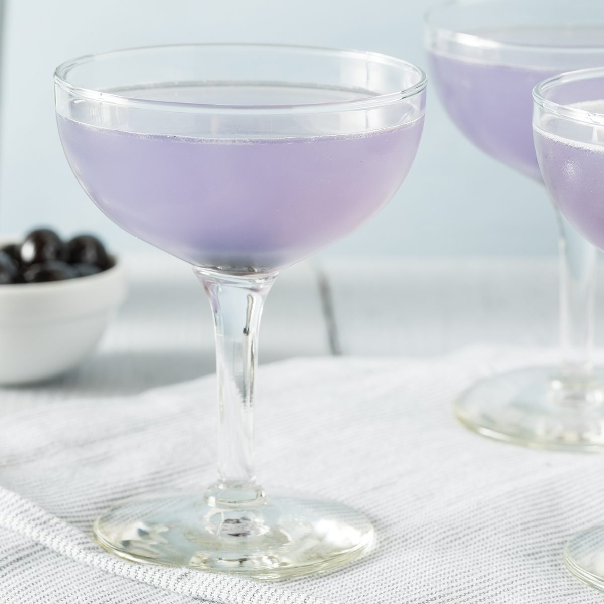 Sweet Violet Aviation Cocktail with a Cherry Garnish