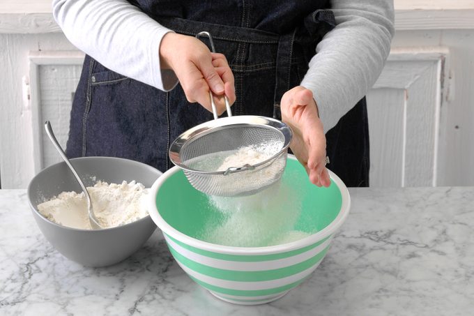 Sifting flour for cake