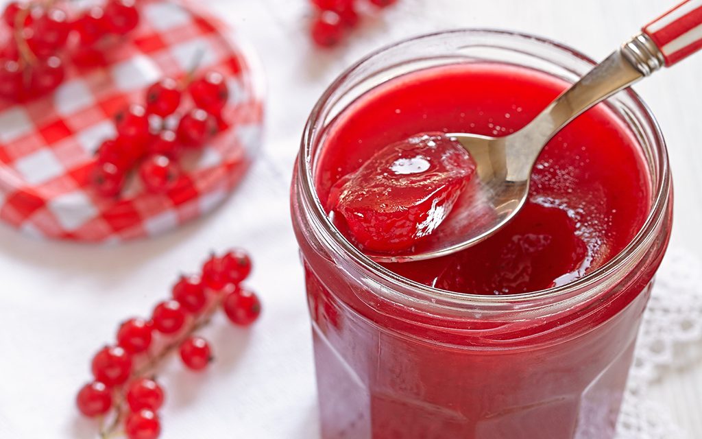 Red currant jelly in a glass jar