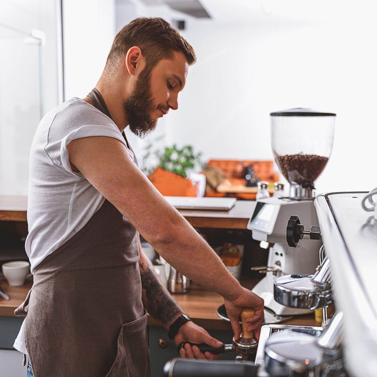 https://www.tasteofhome.com/wp-content/uploads/2019/08/bearded-barista-tamping-ground-coffee-shutterstock_520565953.jpg?fit=700%2C700