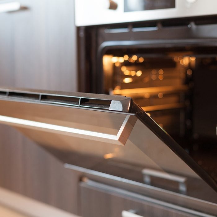 Empty open electric oven with hot air ventilation.