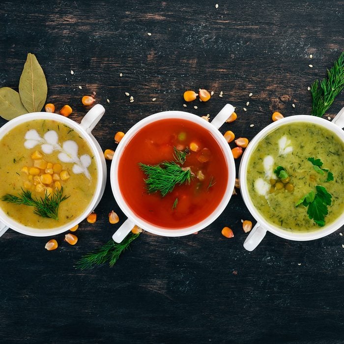 Set of hot, colored vegetable soups. Broccoli soup, corn, tomato soup.