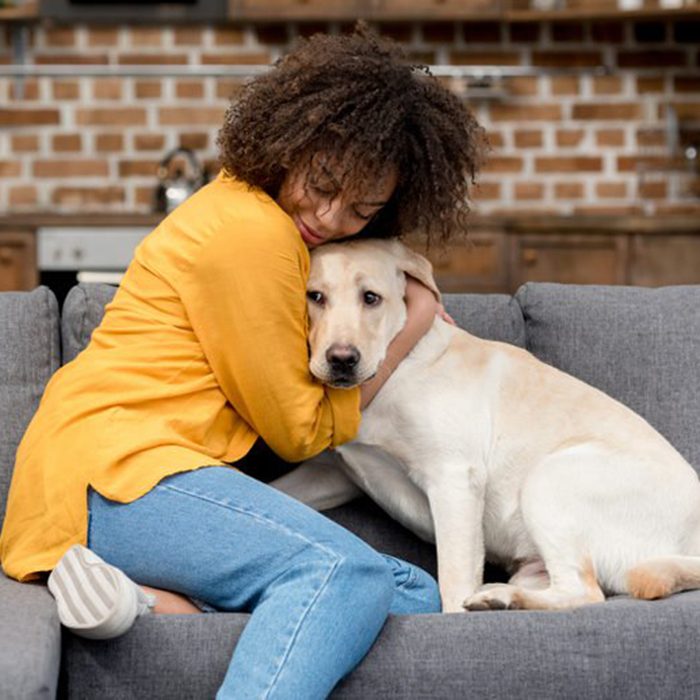 Woman hugging her dog