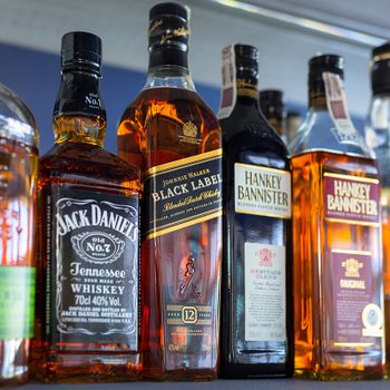 Gdansk, Poland - May 24, 2018: Selection of whiskey bottles on the bar shelf. Selective focus on the Johnnie Walker Black Label bottle.; Shutterstock ID 1101170873; Job (TFH, TOH, RD, BNB, CWM, CM): Taste of Home