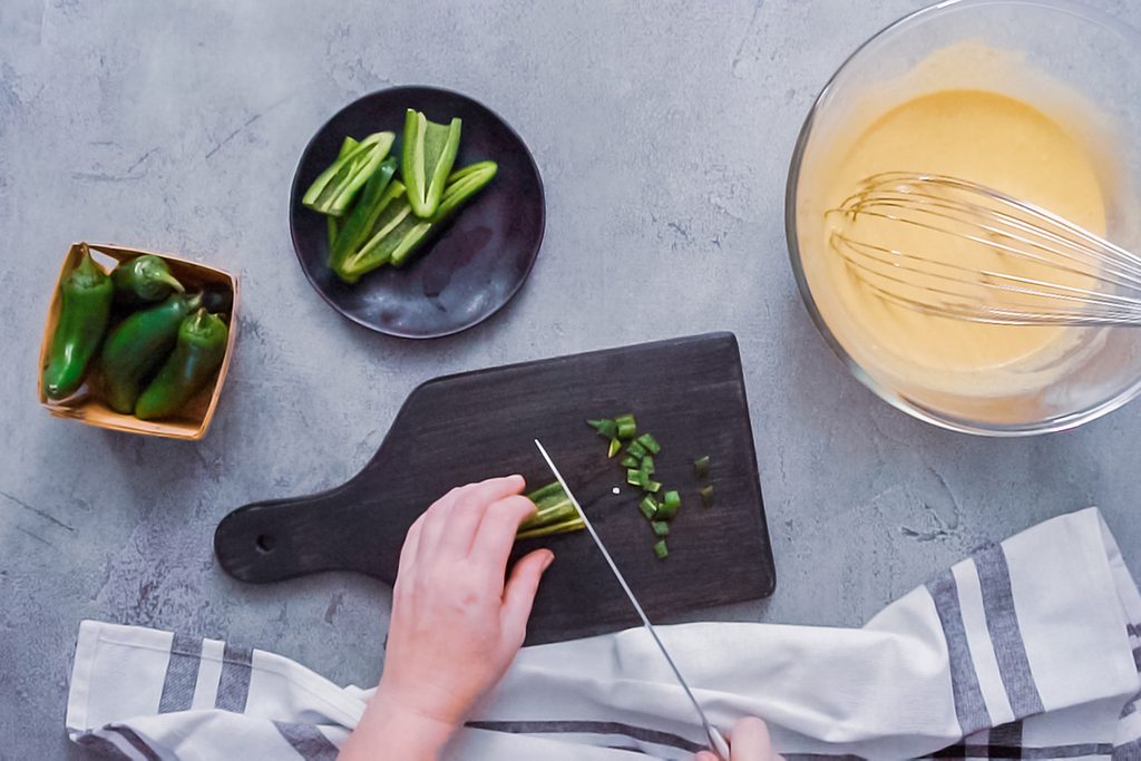 Step by step. Flat lay. Slicing jalapeno peppers for spicy jalapeno cornbread.