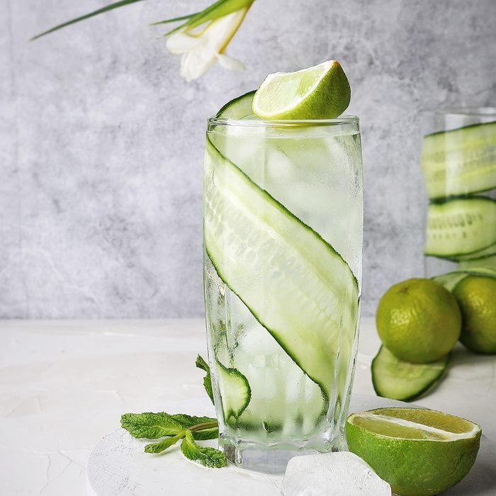 Cocktail with cucumber and lime fresh ice tonic summer alcohol green transparent on the table drink refreshing bar; Shutterstock ID 1437877766; Job (TFH, TOH, RD, BNB, CWM, CM): TOH