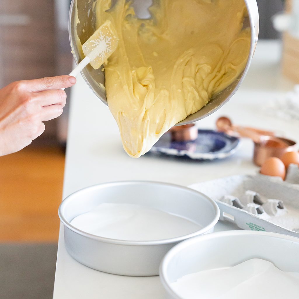 pouring vanilla batter into cake pan; Shutterstock ID 1485158234; Job (TFH, TOH, RD, BNB, CWM, CM): TOH