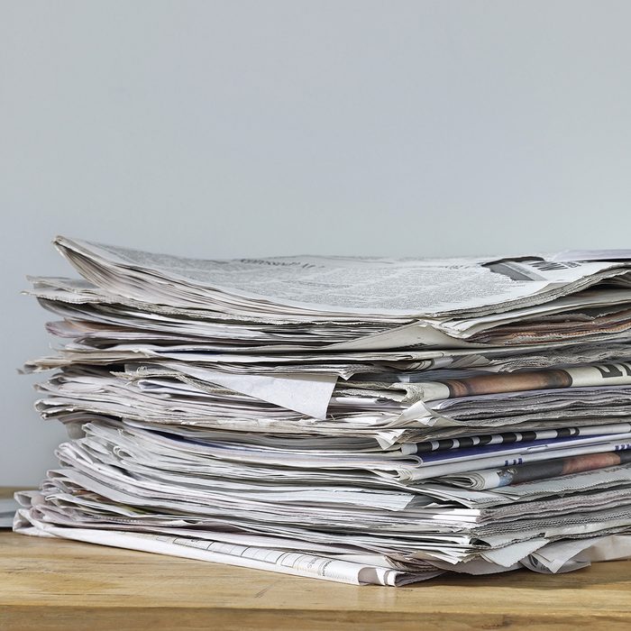 Stack of newspapers on table