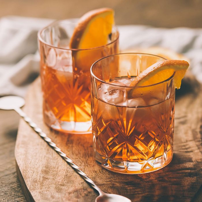 Two glasses of cocktail with orange slice