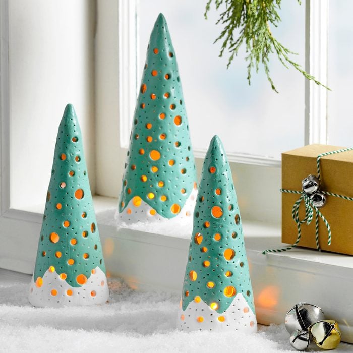 Country Woman Magazine's Seasonal Home Decor Clay Trees Craft Project against a Bright window with the window ledge decorated for the Christmas Holiday 