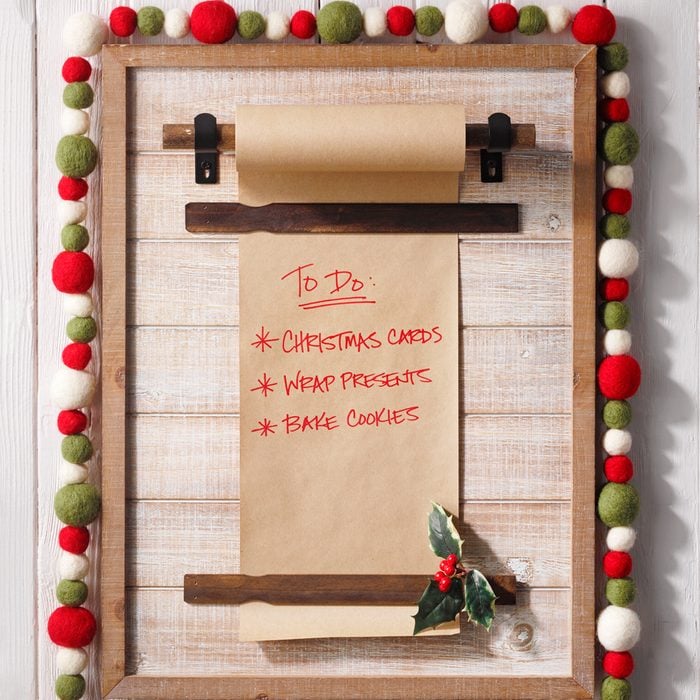 Felt Garland Wrapped Around a Vertical Style Bulletin Memo Board for a Farmhouse Inspired Christmas Decoration