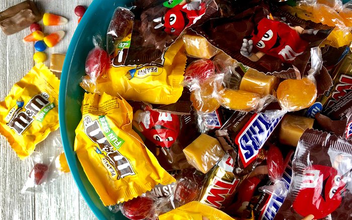 Halloween candy in a plastic bowl