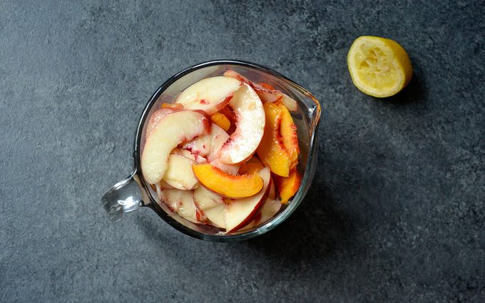 Nectarines in a measuring cup