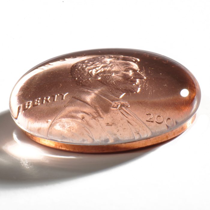 Demonstration of surface tension on a penny using regular water