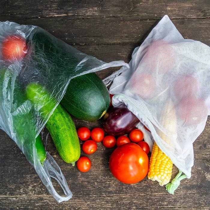 Plastic bags filled with produce