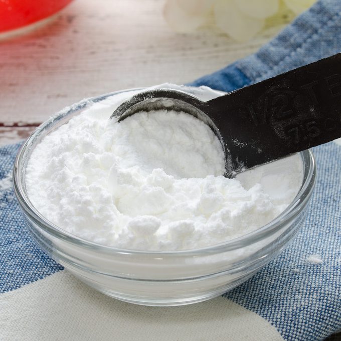 Baking powder being measured for a recipe.; Shutterstock ID 640739113