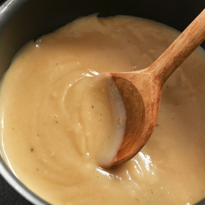 Tasty turkey gravy in saucepan; Shutterstock ID 670955218